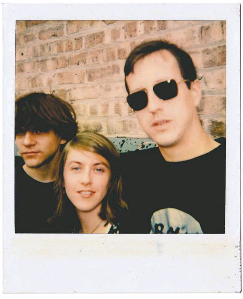 Casey Rice, Liz Phair, and Brad Wood appear outside Idful Music Corp. in 1993 (John McEntire)